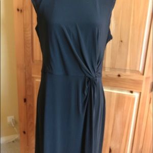 New solid black sleeveless sheath dress.